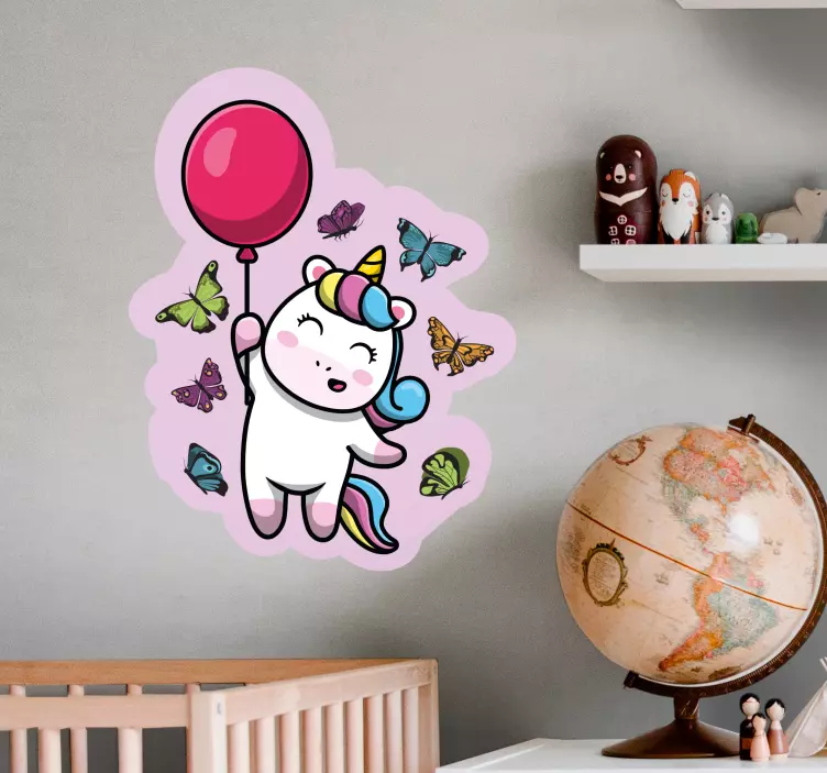 Playful unicorn with balloon kid's sticker - TenStickers