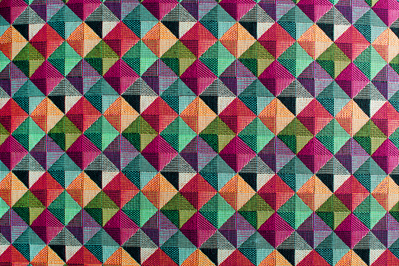 Geometric multicolored textile pattern rug - TenStickers